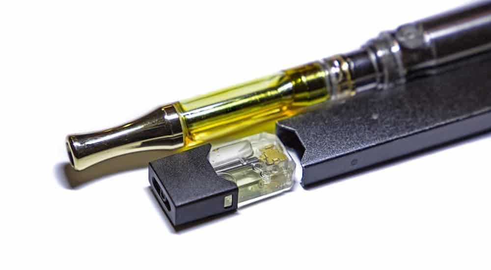 Two oil vape pens are shown.