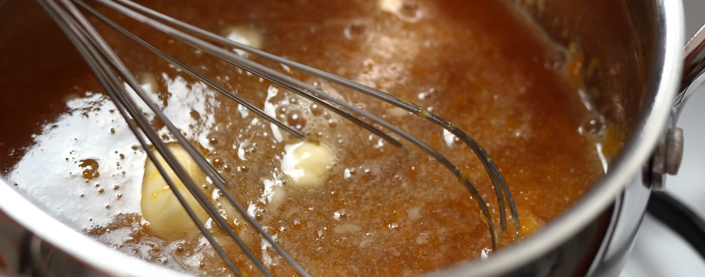 Hash butter is being cooked in a sauce pan.